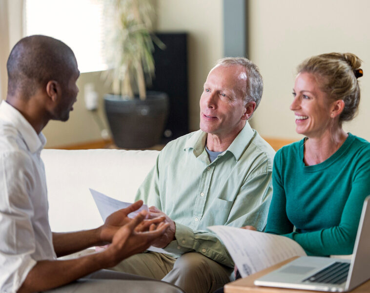 Couple speaking with an advisor