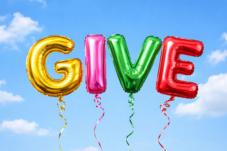 Charitable giving photo of balloons spelling Give