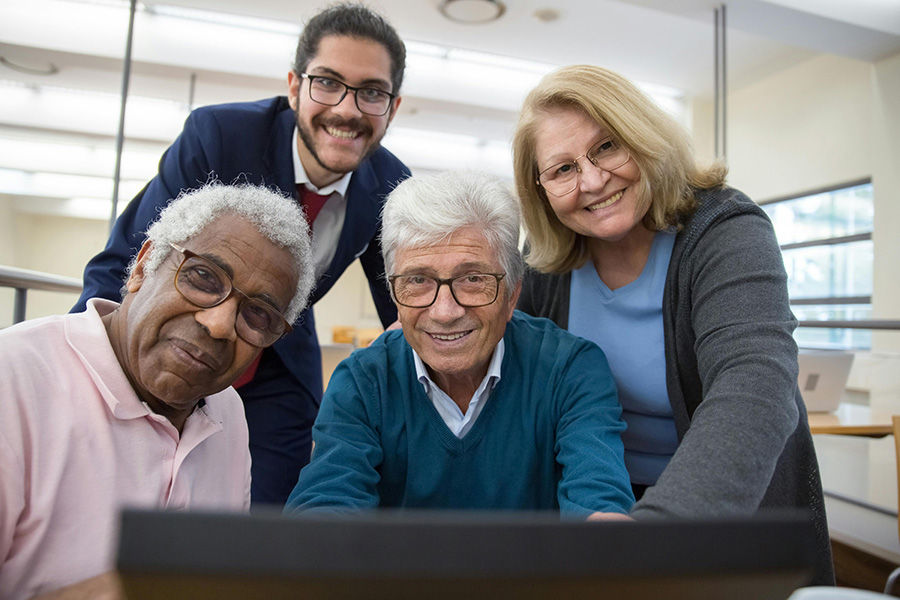 What type of donor are you - diverse group of adults looking at a computer.